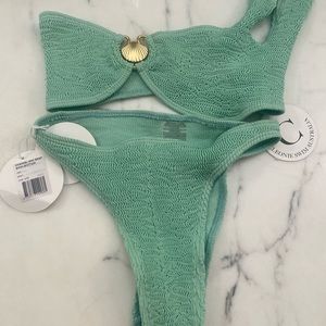Crinkle knit, one shoulder bikini in Mint Green with seashell